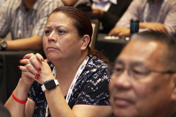 Woman listening at TribalNet Conference