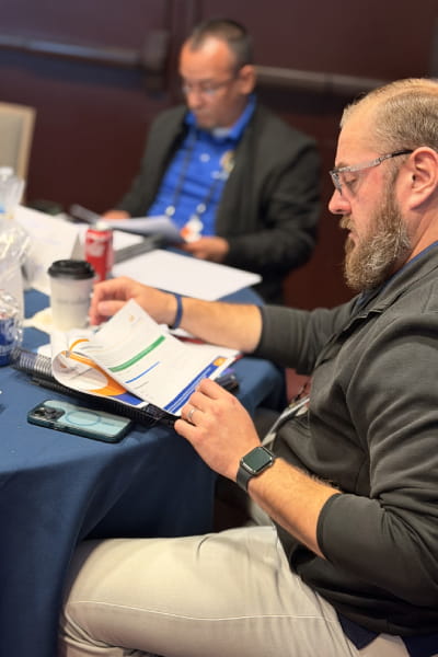 CTTP students looking at handouts