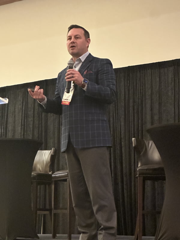 Speaking giving a presentation at a TribalHub event