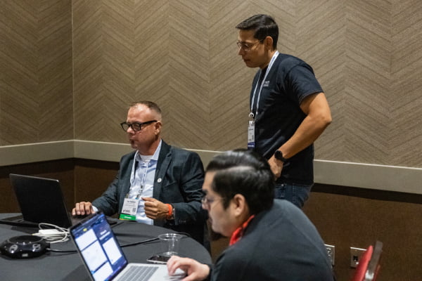 Group of people working on a cybersecurity challenge